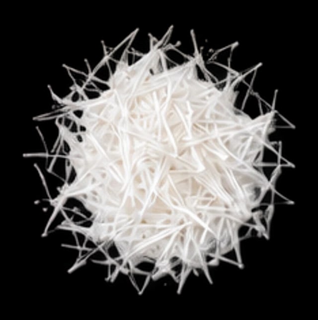 Fine white needle crystals of biotin