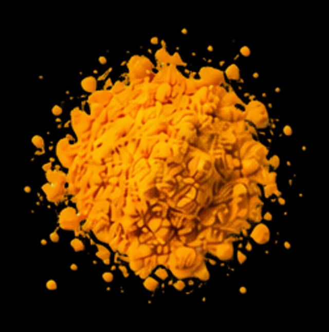 A pinch of orange-yellow riboflavin powder