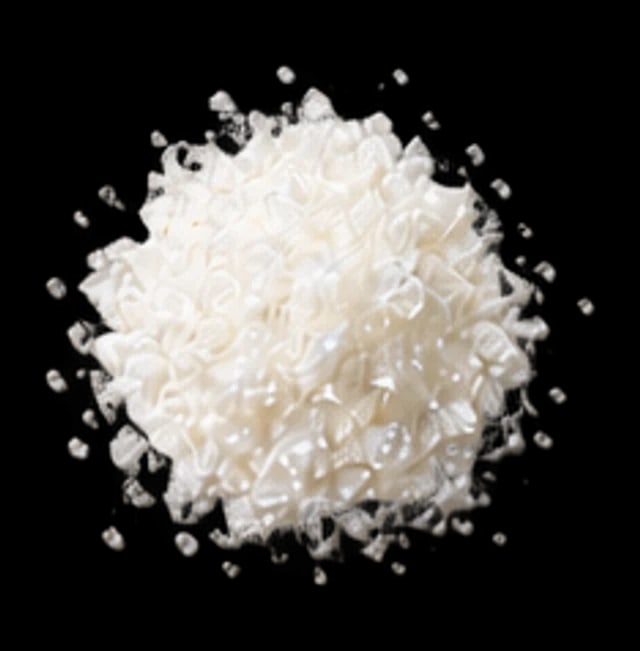 A heap of white vitamin C crystals